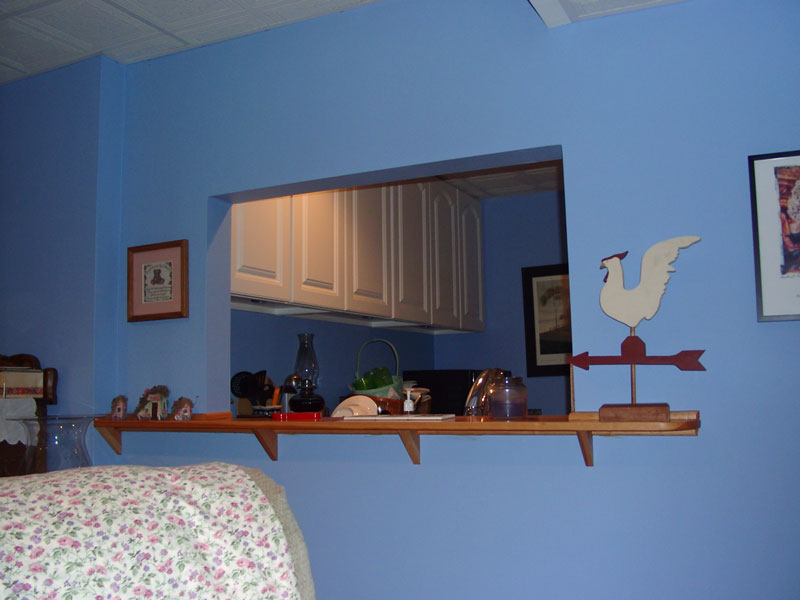 View of downstairs kitchenette though a pass-through.